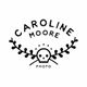 Logo with "Caroline Moore Photo" and a stylized skull framed by leafy branches.