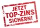 Roter Stempel mit der Aufschrift: "JETZT TOP-ZINS SICHERN!"