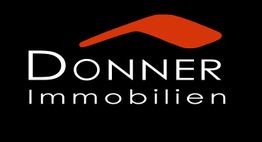 Logo von Donner Immobilien mit orangenem Dachelement auf schwarzem Hintergrund.