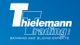 Logo von "Thielemann Trading GmbH" auf blauem Hintergrund, Schriftzug in Weiß.