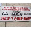Pawn shop sign: "We pay the most for gold, silver & diamonds. Your #1 pawn shop."