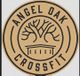 Logo of Angel Oak CrossFit with a stylized tree and building in tan and black.