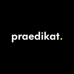 Text "praedikat." in Weiß auf schwarzem Hintergrund, Punkt in Gelb.
