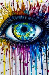 Ojo azul con colores vibrantes salpicando alrededor.