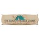Logo of The Woodworkers Shoppe with a saw blade and tree design on wood-textured background.
