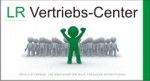 Grüne Figur hebt die Arme vor einer Gruppe; Text: "LR Vertriebs-Center".