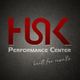 Logo mit rotem "HSK", grauer Schrift "Performance Center", Text "built for results" darunter.