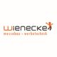 Logo von Wienecke mit Text: "messebau + werbetechnik" und einer tanzenden Figur in Orange.