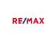 Logo von RE/MAX mit rotem und blauem Schriftzug auf weißem Hintergrund.