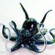 Colorful glass octopus sculpture with detailed swirling tentacles.