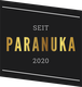 Schwarzes Logo mit Text: "SEIT PARANUKA 2020" in weiß und gold.