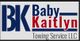 Logo of BK Baby Kaitlyn Towing Service LLC in blue and red text.