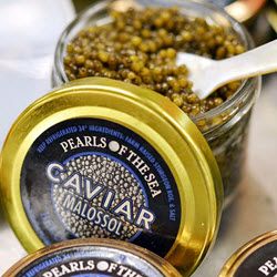 Jar of Malossol caviar with a spoon, labeled "Pearls of the Sea."