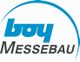 Logo mit blauem Schriftzug "boy" und "Messebau", umgeben von einem blauen Halbkreis.