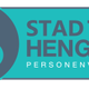 Logo van Stad Taxi Hengelo met tekst “Personenvervoer” en afbeelding van een wiel met vleugel.