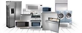 A variety of modern kitchen appliances, including a fridge, oven, microwave, and laundry machines.
