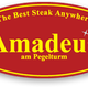 Rotes Logo mit gelbem Text "Amadeus am Pegelturm", "The Best Steak Anywhere", Sterne darüber.