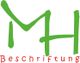 Grünes "MH" mit rotem Text "Beschriftung" darunter auf weißem Hintergrund.