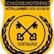 Gelbes Schild mit zwei Schlüsseln, Lorbeerkranz und Text: "Schlüsselnotdienst Dortmund".