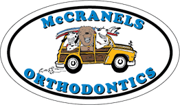 Cartoon animals in a car with the text "McCRANELS ORTHODONTICS" in an oval frame.