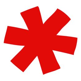 Asterisco rosso irregolare su sfondo bianco.