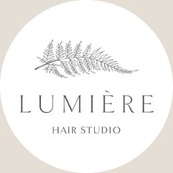 Logo of Lumière Hair Studio featuring a fern leaf above the text.