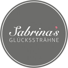 Grauer Kreis mit weißem Text: "Sabrina's Glückssträhne". Minimalistisches Logo-Design.