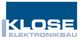 Logo mit der Aufschrift "KLOSE ELEKTRONIKBAU" in blauem und weißem Text.