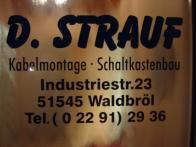 Schild mit der Aufschrift: "D. Strauf, Kabelmontage, Schaltkastenbau, Waldbroel."