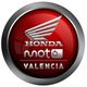 Logotipo de Honda Moto Valencia en un círculo rojo con borde plateado.