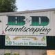 B&D Landscaping celebrates 30 years in business with a banner and balloons.