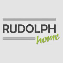 Schriftzug "RUDOLPH home" auf grauem Hintergrund, "home" in grüner, geschwungener Schrift.