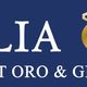 "Insegna blu con testo Italia Oro, Outlet Oro & Gioielli in bianco e oro."