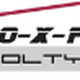 Logo mit Text "IMMO-X-PERT Scholtysek" und stilisiertem roten Dach darüber.