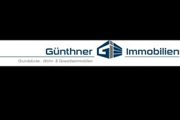Logo von Günthner Immobilien mit blauer Schrift und Symbol auf weißem Hintergrund.
