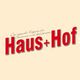 Logo mit rotem Text "Haus+Hof" auf beigem Hintergrund, dekorativer Schriftzug oben.