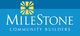 Logo of MileStone Community Builders with yellow sunburst design on a blue background.
