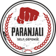 Ein rotes Faust-Logo mit der Aufschrift "Paranjali Self-Defense", umgeben von roten Blättern.