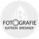 Logo mit der Aufschrift "Fotografie Katrein Brenner" und stilisiertem Flammenmotiv im Hintergrund.