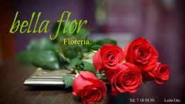 Rosas rojas sobre una mesa, texto: "bella flor, florería". Teléfono y ubicación al fondo.