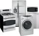 A group of kitchen appliances: stove, refrigerator, microwave, and washing machine.