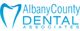 A logo featuring a tooth outline and the text "Albany County Dental Associates" in blue.