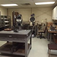 A laboratory room with equipment and workstations.