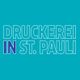 Text „Druckerei in St. Pauli“ auf blauem Hintergrund.