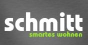 Schriftzug: "schmitt smartes wohnen" auf grauem Hintergrund.