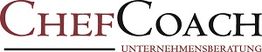 Logo mit der Aufschrift "ChefCoach Unternehmensberatung" in schwarz und rot.