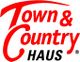 Logo mit roter Schrift "Town & Country", darunter schwarz "HAUS" auf weißem Hintergrund.
