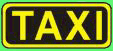 Gelbes "TAXI"-Schild mit schwarzem Hintergrund und gelbem Rand.