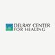 Delray Center for Healing logo with a spiral design on a gradient blue-green square.