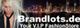 Ein Model vor einer Stadt-Silhouette. Text: "Brandlots.de Your V.I.P FashionStore".